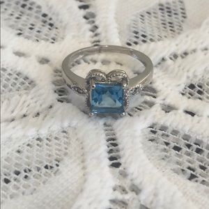 White gold and blue topaz ring